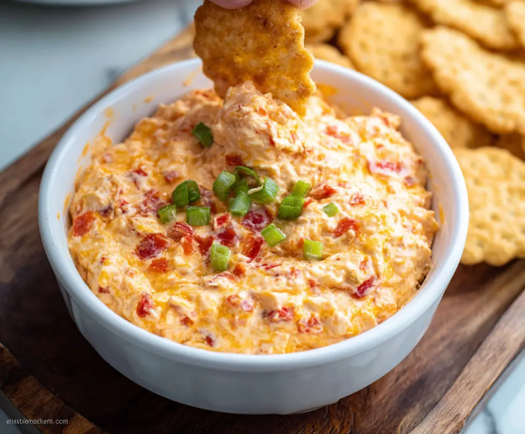 Creamy Pimento Cheese Dip served with crunchy crackers and fresh vegetables.
