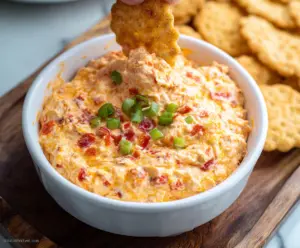 Creamy Pimento Cheese Dip served with crunchy crackers and fresh vegetables.
