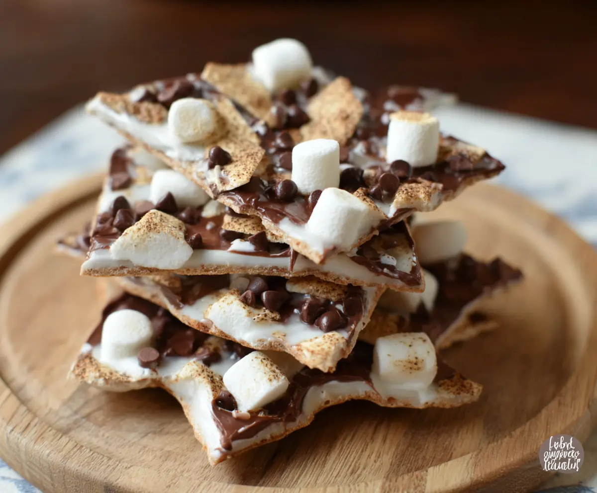Delicious S'mores Yogurt Bark topped with graham crackers, chocolate, and marshmallows ready for a tasty treat