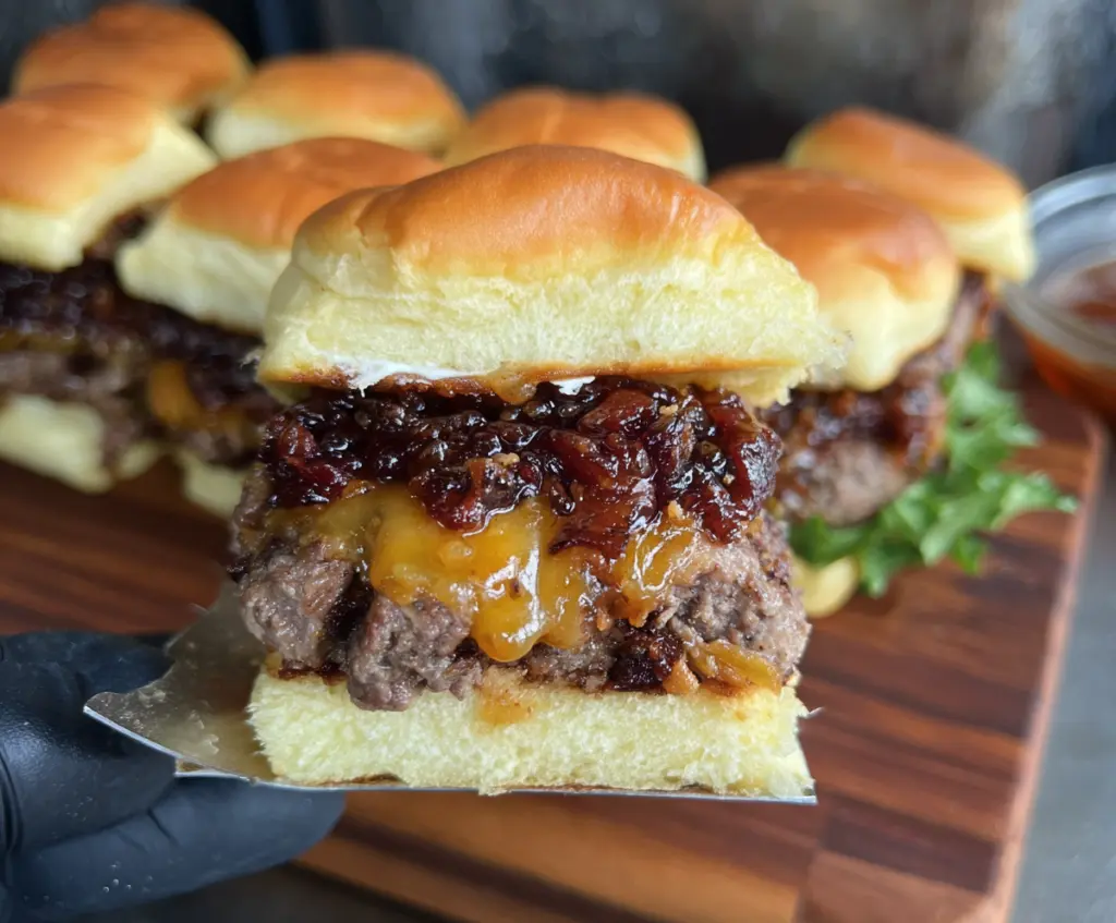 Delicious Bacon Jam Cheeseburger Sliders with melted cheese and crispy bacon on soft slider buns