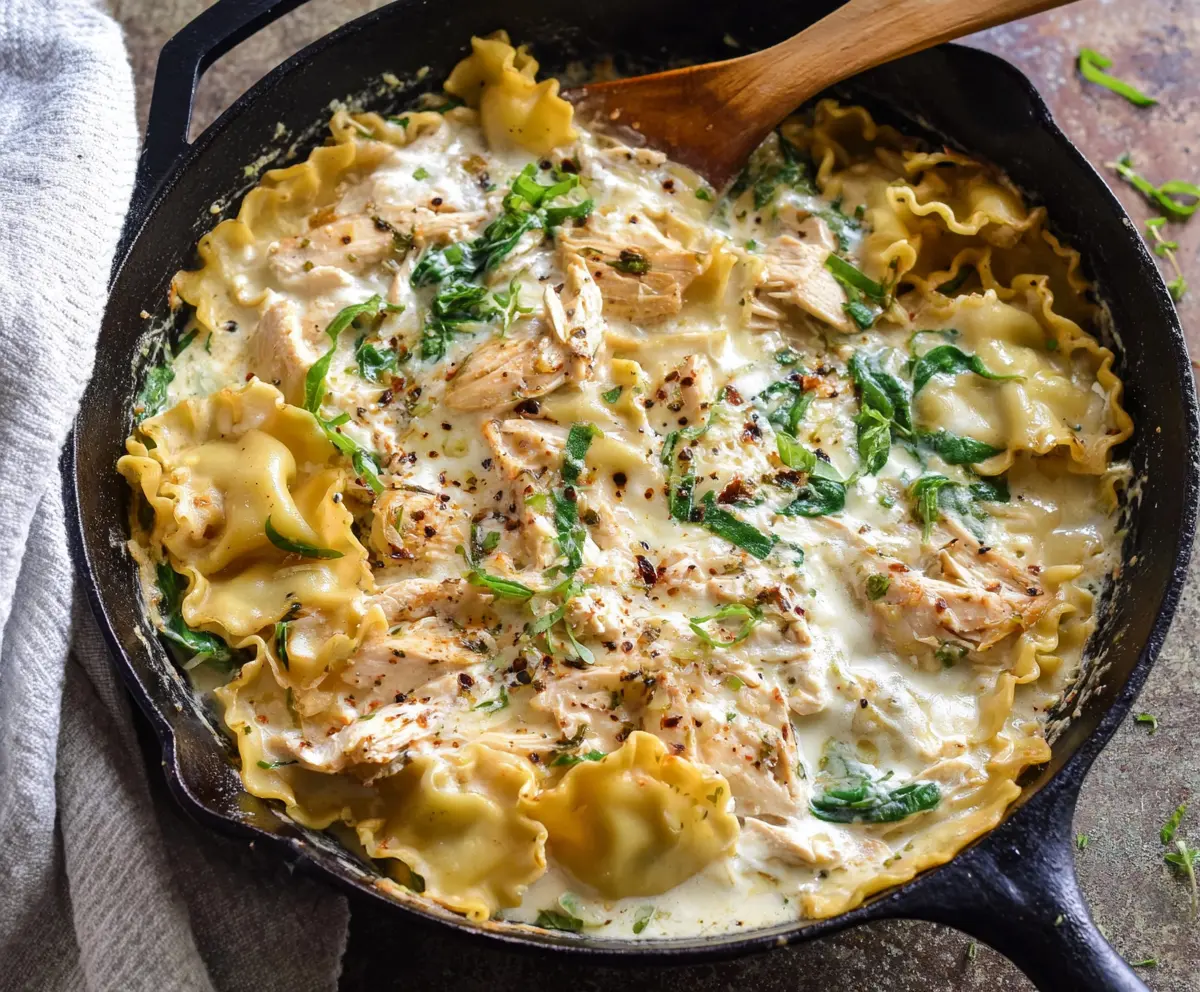 Delicious white chicken skillet lasagna with melted cheese and creamy sauce