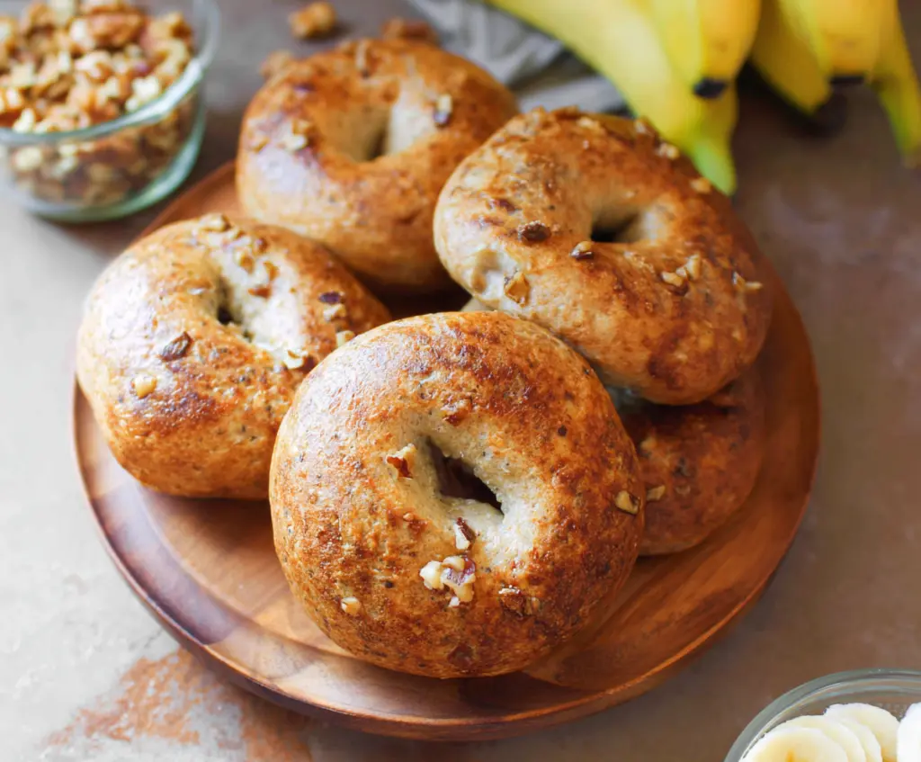 Freshly baked banana nut bagels with ripe bananas and crunchy nuts on top.